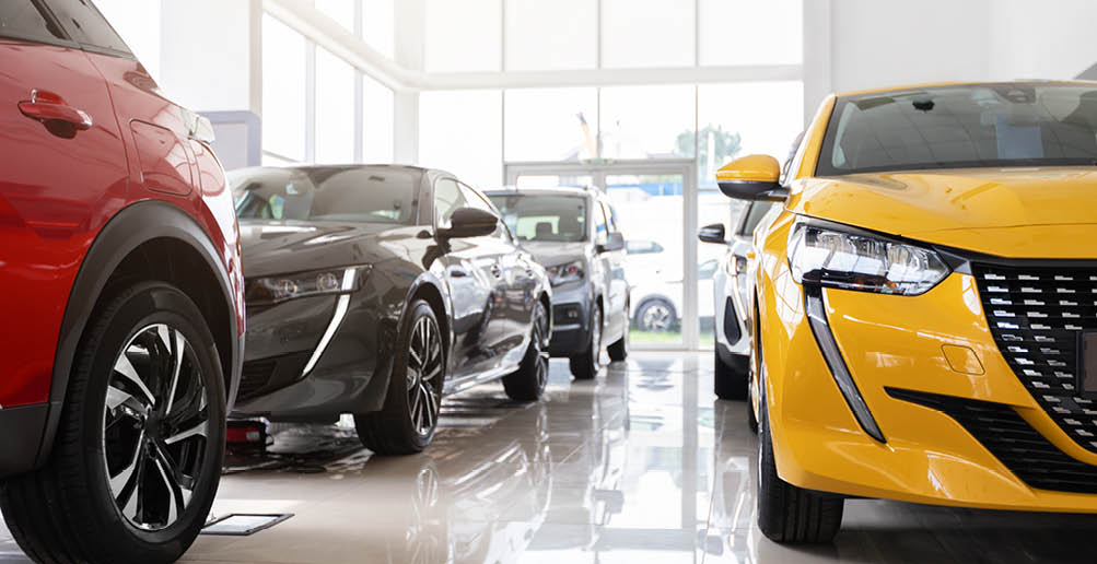 Various beautiful modern sports, family, medium, multi purpose cars different colours and features at huge luxury dealership salon. Automobiles for sale, auto showroom, copy space