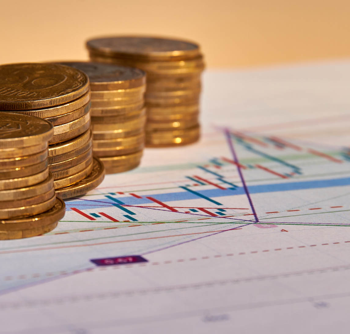 Stacks of money coins with graph paper. Concept of account finance and growth of business.