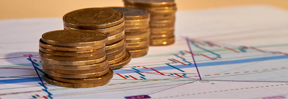Stacks of money coins with graph paper. Concept of account finance and growth of business.